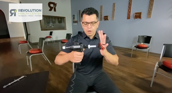 Dr. Oscar Noriega DC using chiropractic tool