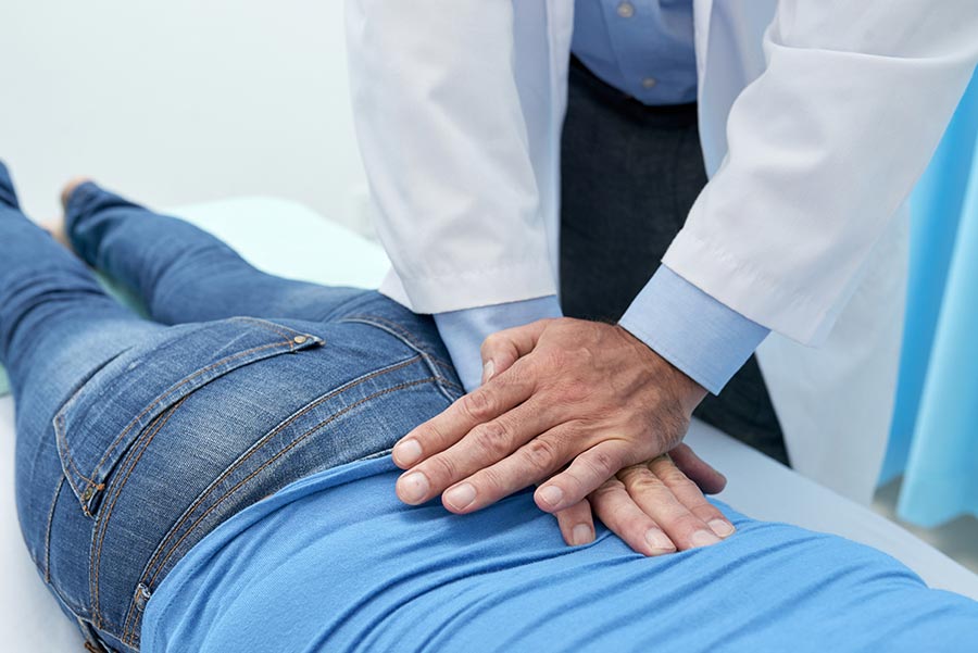 dr. adjusting a patient with sciatica